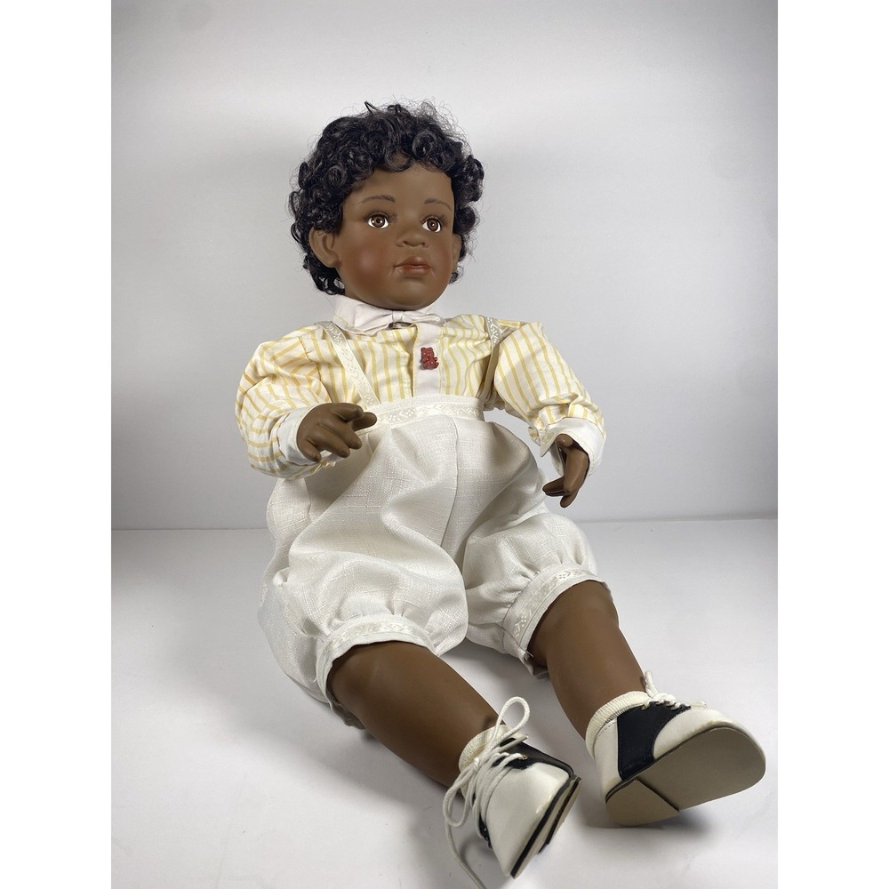 Doll Tyrone, a two year old African American sitting doll, By Laura Cobabe 1996